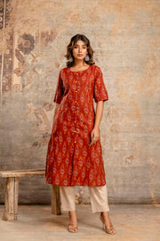 Woman wearing rust Ikat cotton kurta
