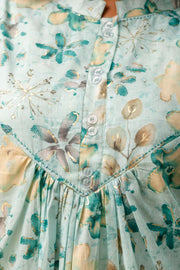 Women’s mint green top with round neck and buttons