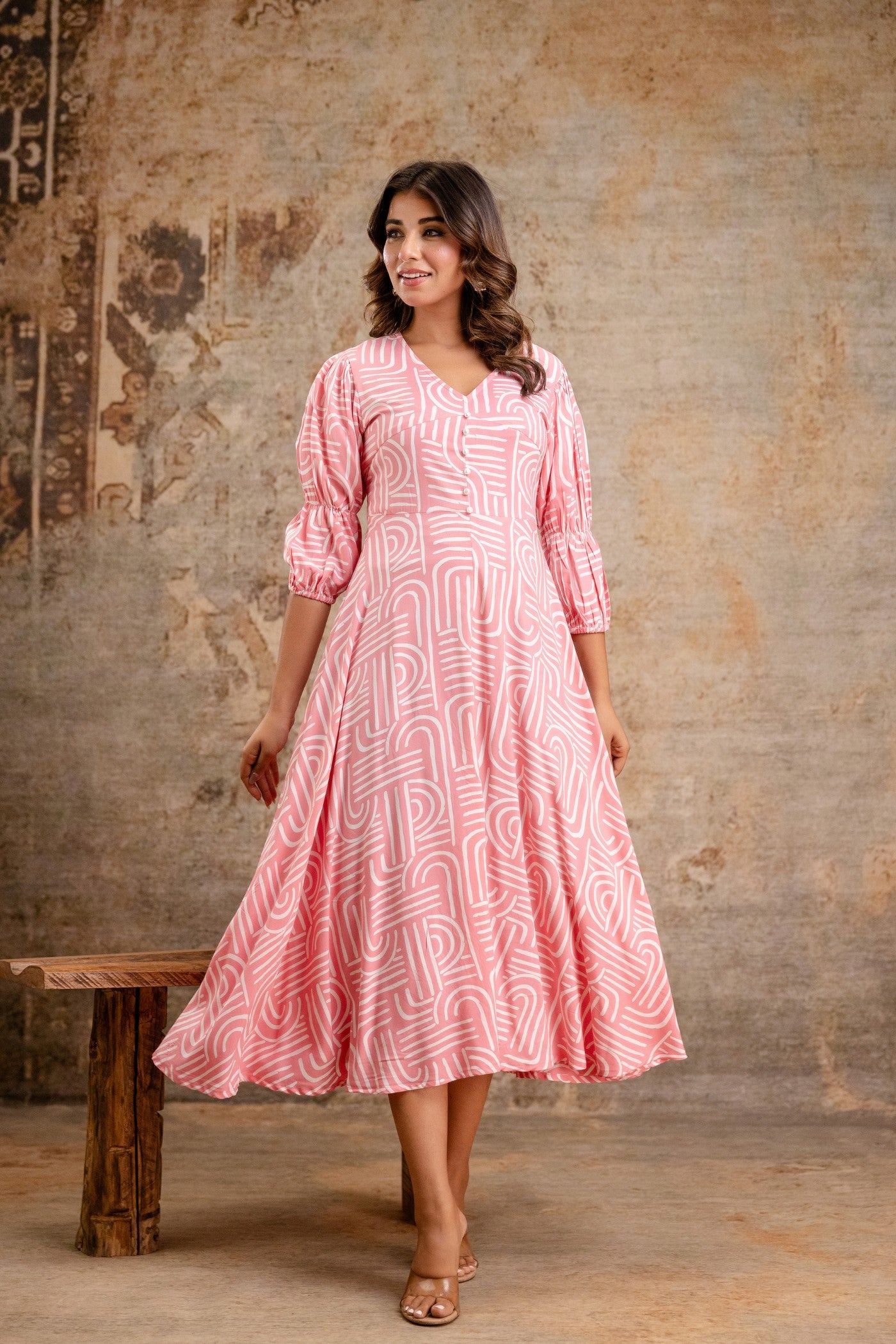 Pink printed rayon middy dress by Aaronee