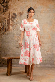 Elegant cream Cotton Flex middy dress with pink floral print by Aaronee, styled with rolled-up sleeves and front buttons