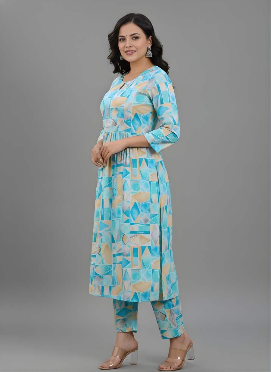 Woman wearing a blue and beige patterned kurta with pants on a gray background