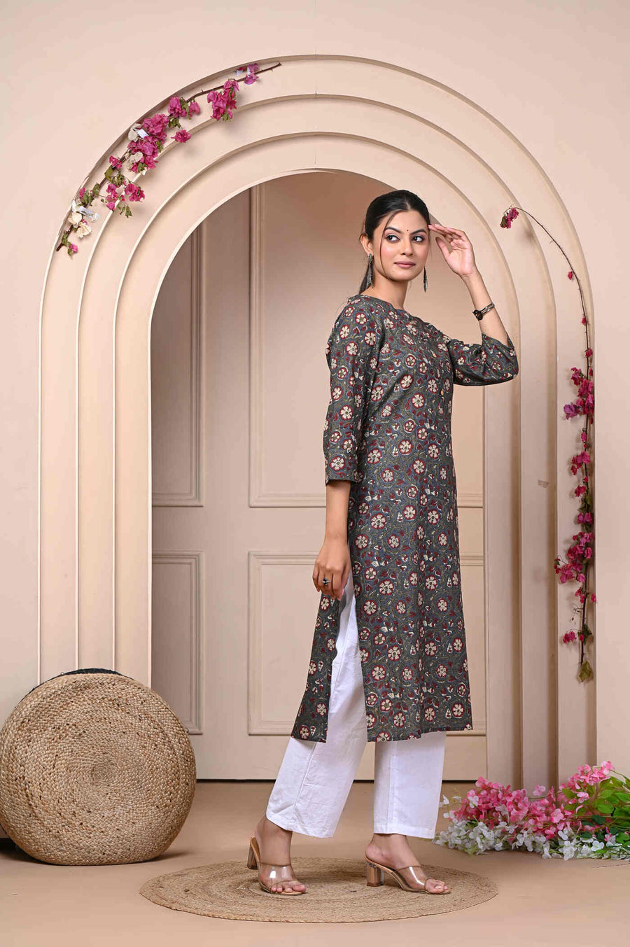 Discover elegance with our Brown Straight Printed Cotton Kurti