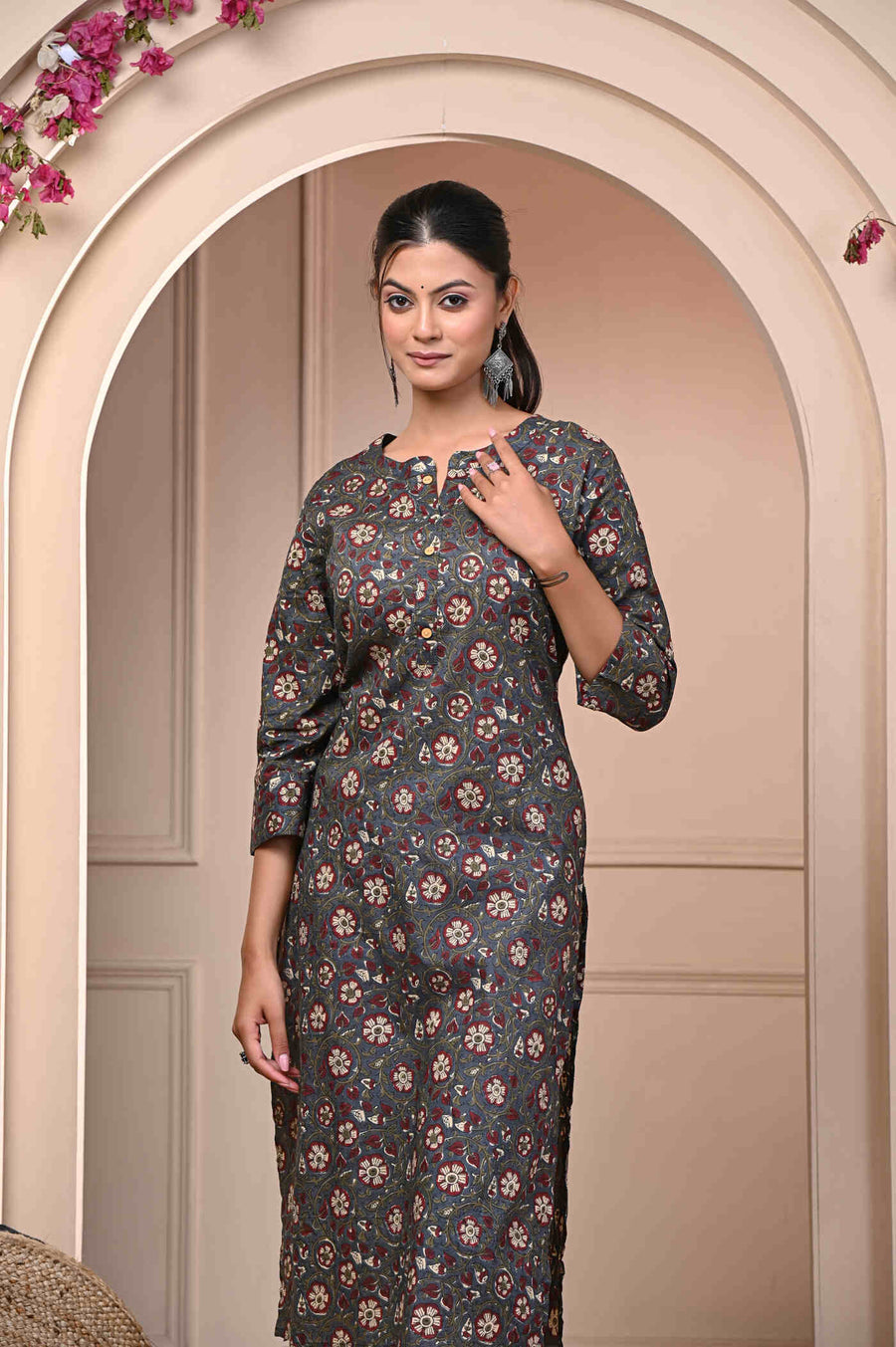 Discover elegance with our Brown Straight Printed Cotton Kurti