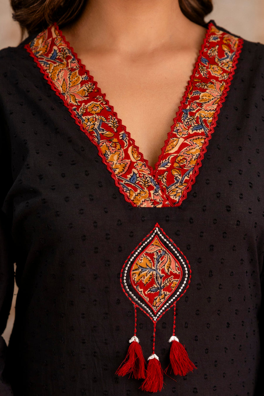 Ethnic wear with lace and tassel detailing