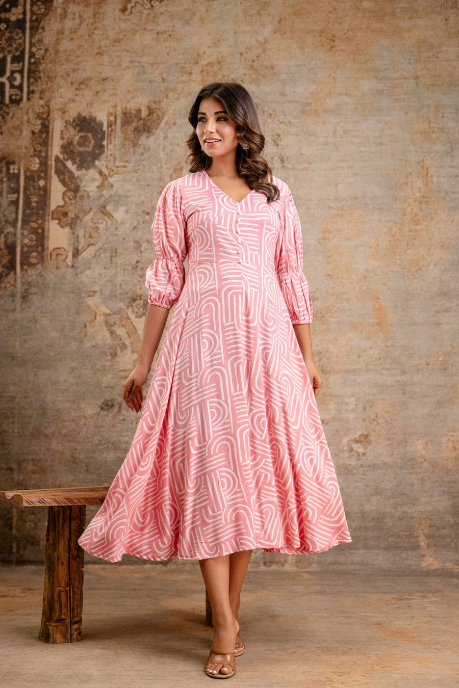 Pink printed rayon middy dress by Aaronee
