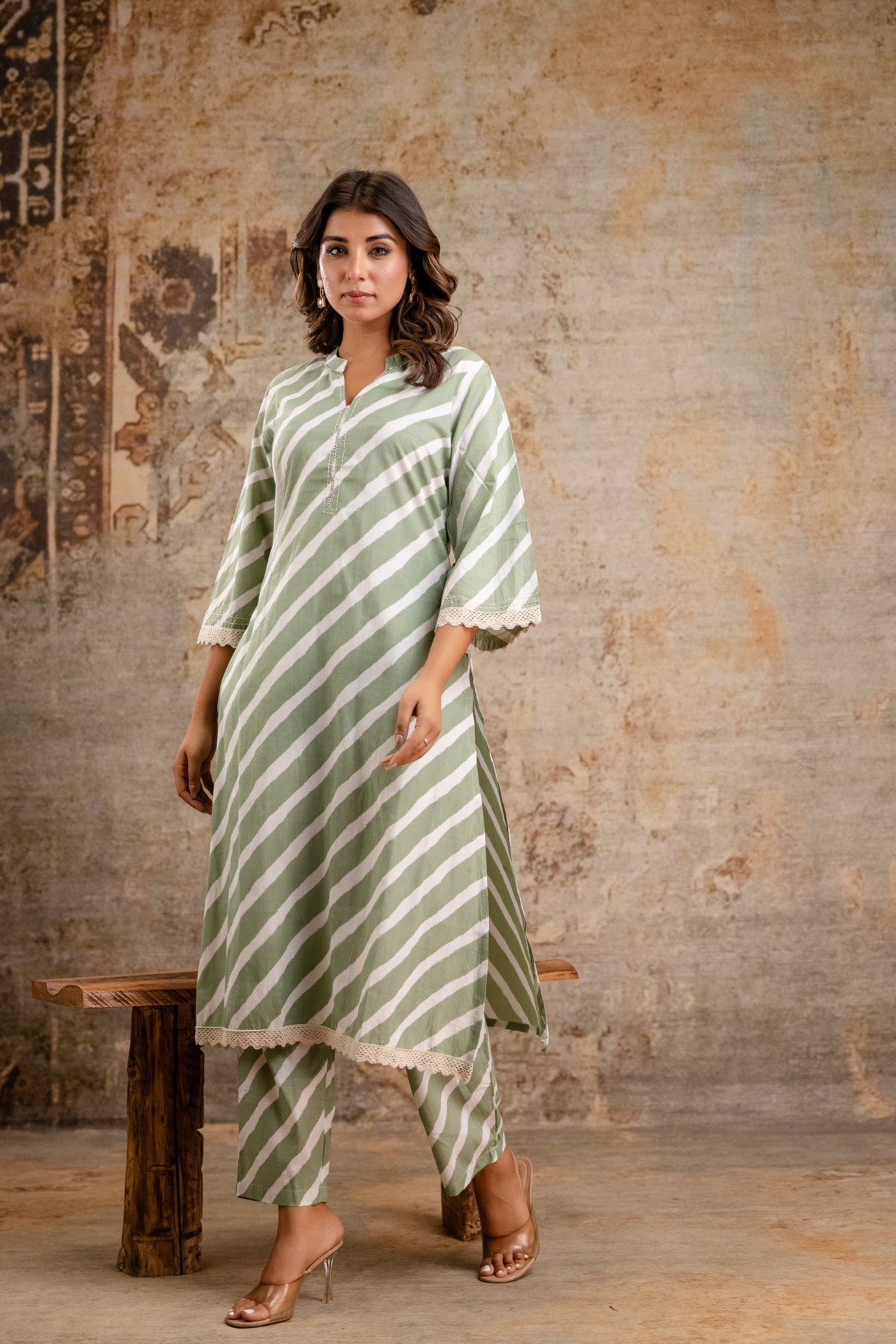 V-neck green kurti with matching bottoms