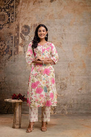 Woman in cream floral cotton kurta set