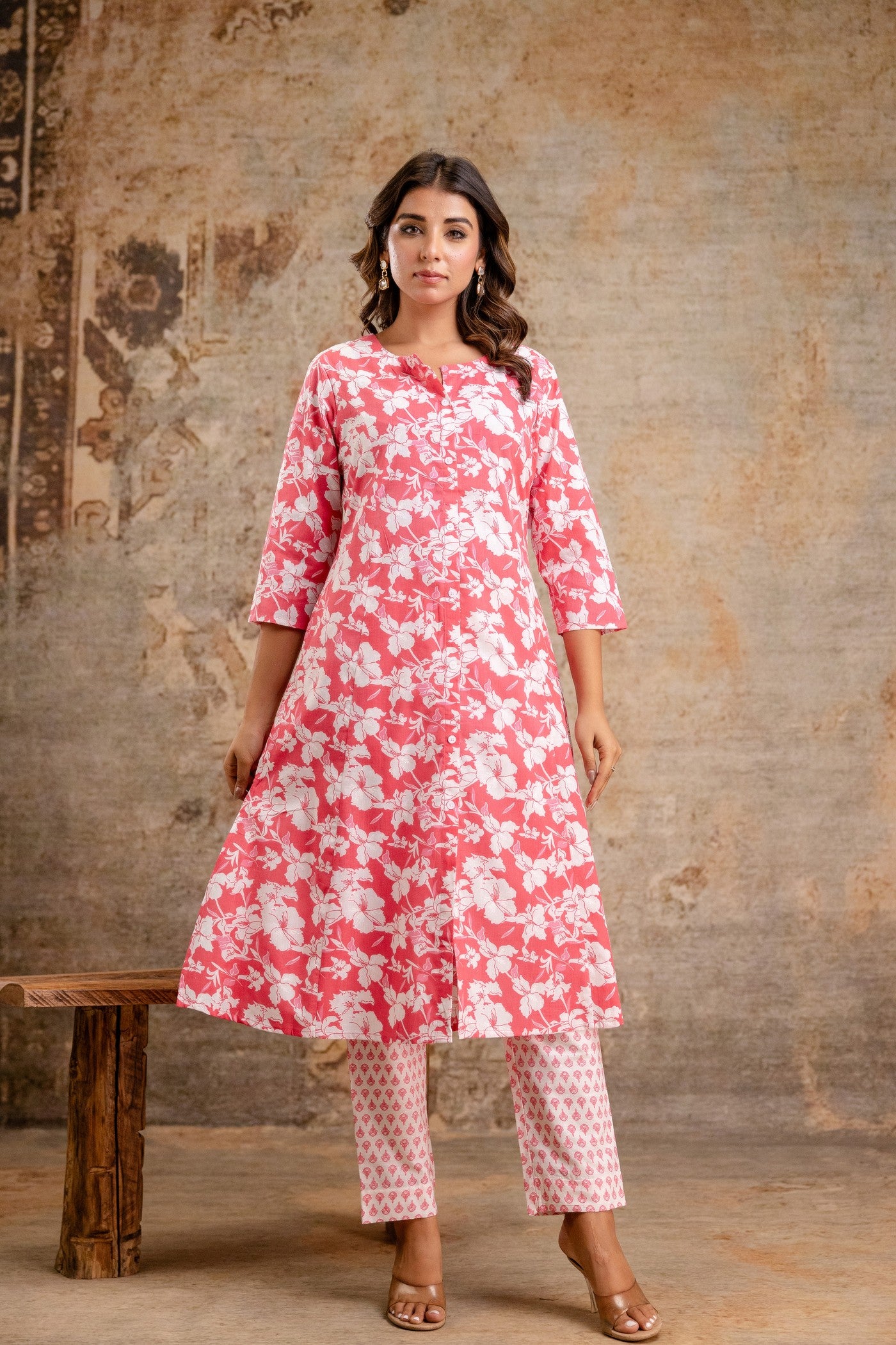Woman wearing pink floral cotton kurta set